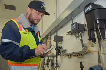 Water/Wastewater Systems Operator IV-On Call Dan Pettinichio checks Water Quality Analyzers.