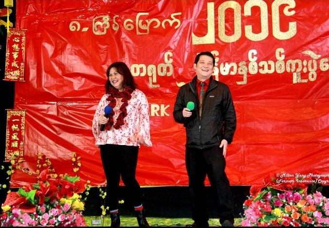 Florence Khaw sings with her husband at a Burmese community event.