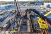 Equipment pumps concrete to form a new primary sedimentation tank.