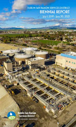 Biennial Report cover with aerial view of primary sedimentation tank construction